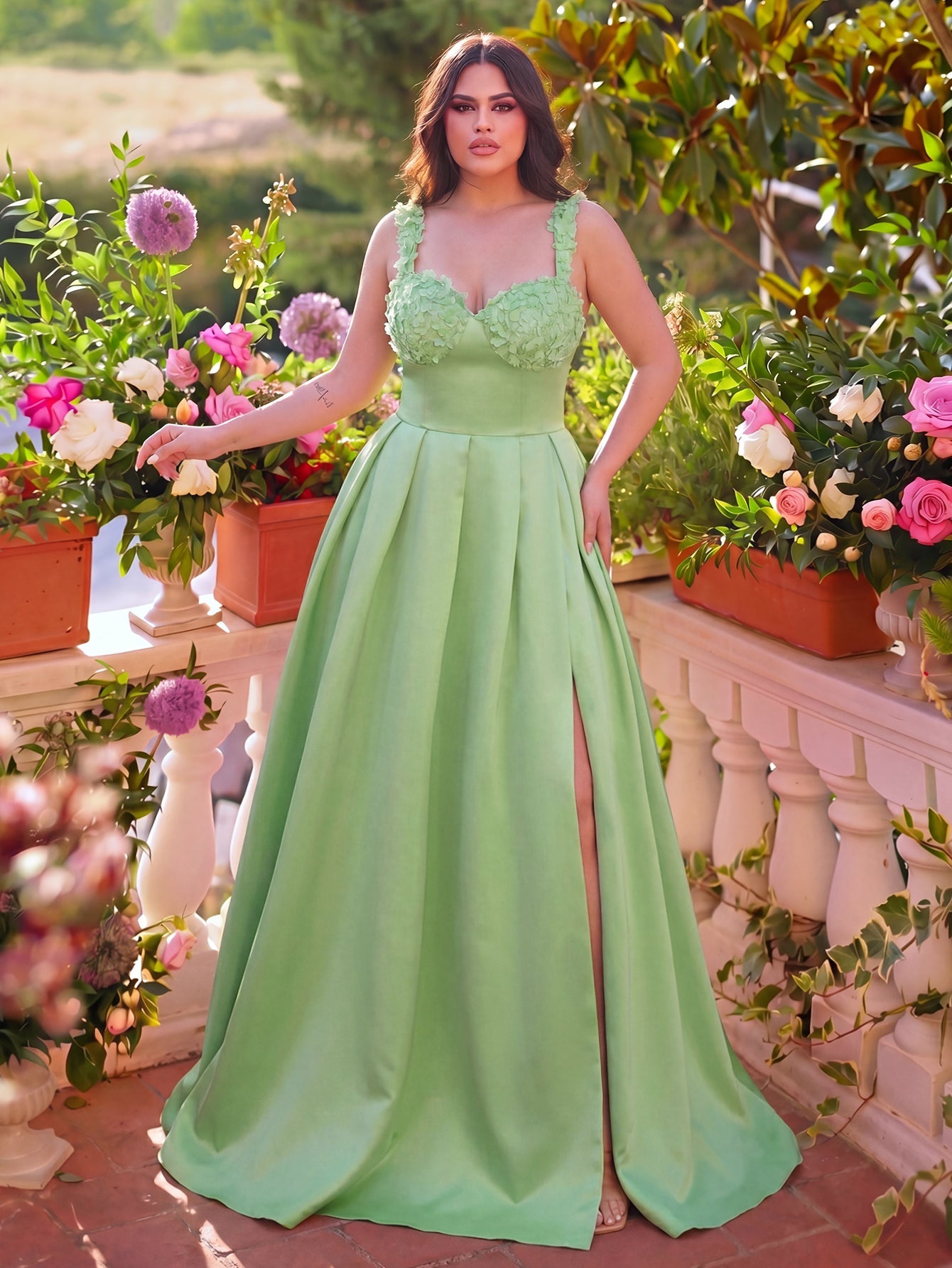 Floral applique detail on green satin prom dress