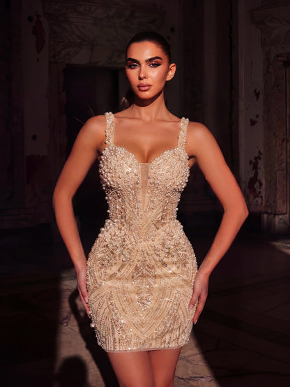 Sequin and beaded detail on apricot mini dress