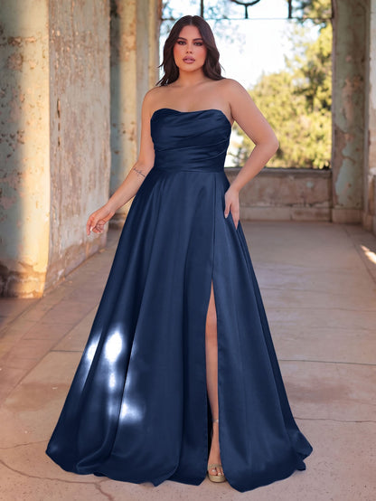 Navy blue strapless satin A-line gown with high slit on model
