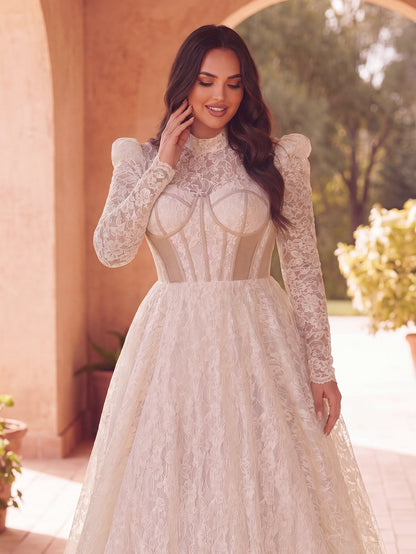 White long-sleeve lace wedding dress, side view