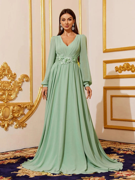 Green chiffon bridesmaid dress with V-neck and floral waist applique